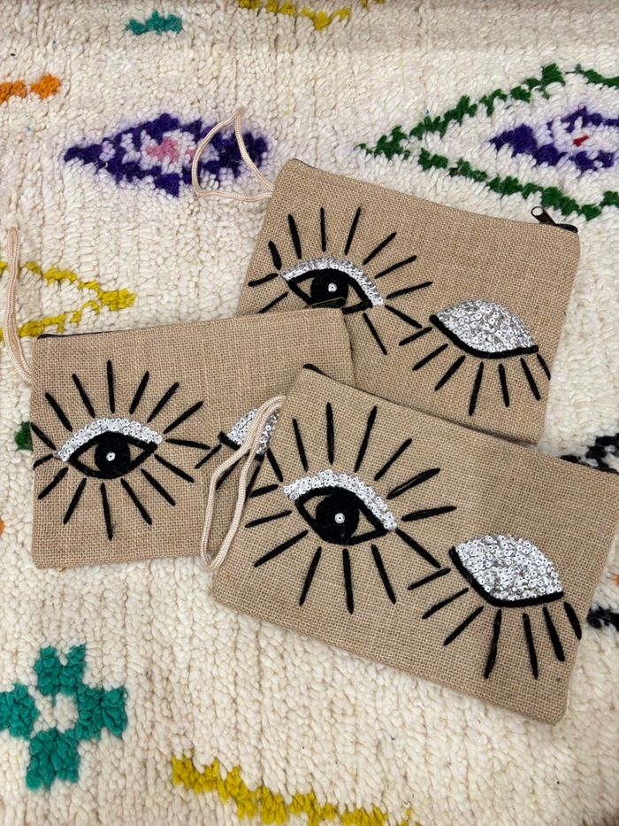 Pochette jute - motifs œil brodé - laine