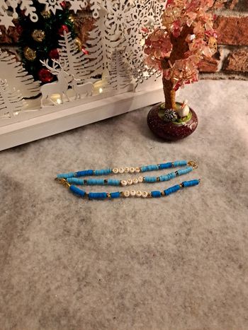 Lot de bracelets bleu et doré heishie