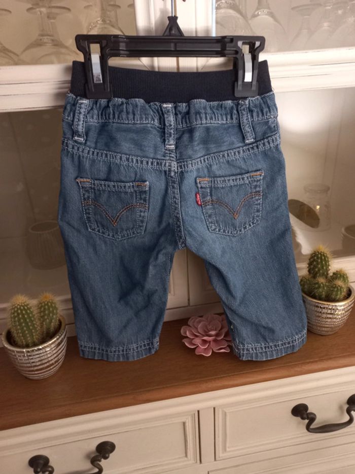 Jean Levis bleu excellent état taille 6 mois - photo numéro 2