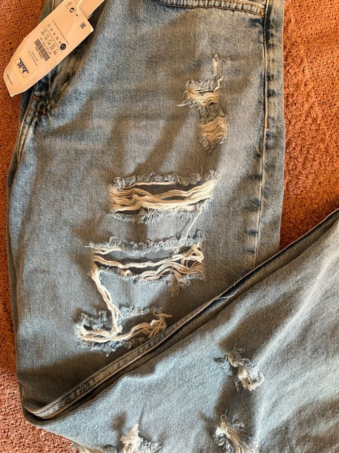 Jeans bleu clair effet déchiré • taille 42 - photo numéro 7