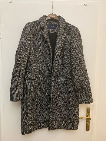 Manteau noir chiné blanc