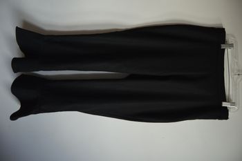 Pantalon noir AMISU coupe évasée bas volanté