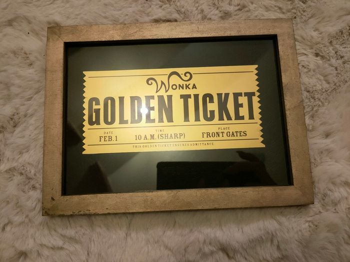 Ticket d'or sous cadre