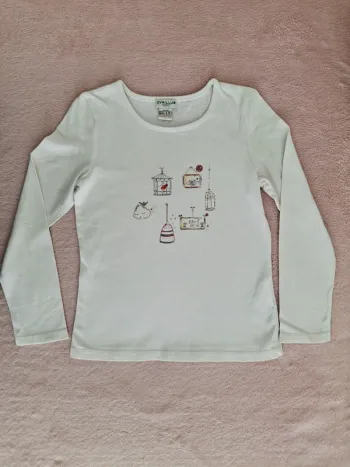 T-shirt manches longues Cyrillus 8 ans blanc motifs cages à oiseaux chat jaunes et oranges