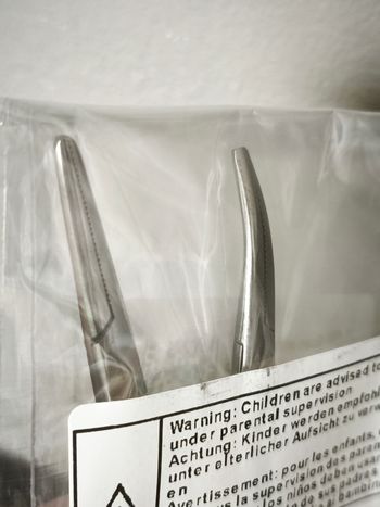 Pince porte aiguilles