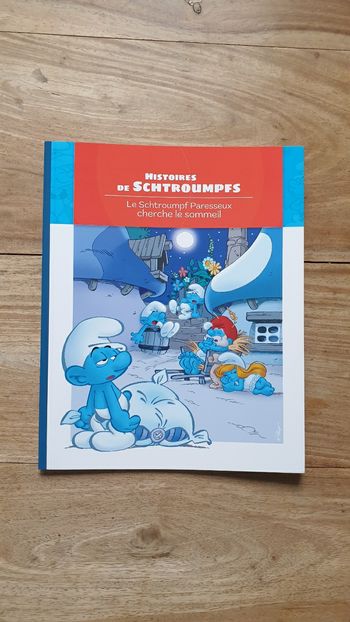 Neuf livre enfant Le Schtroumpf Paresseux cherche le sommeil 
