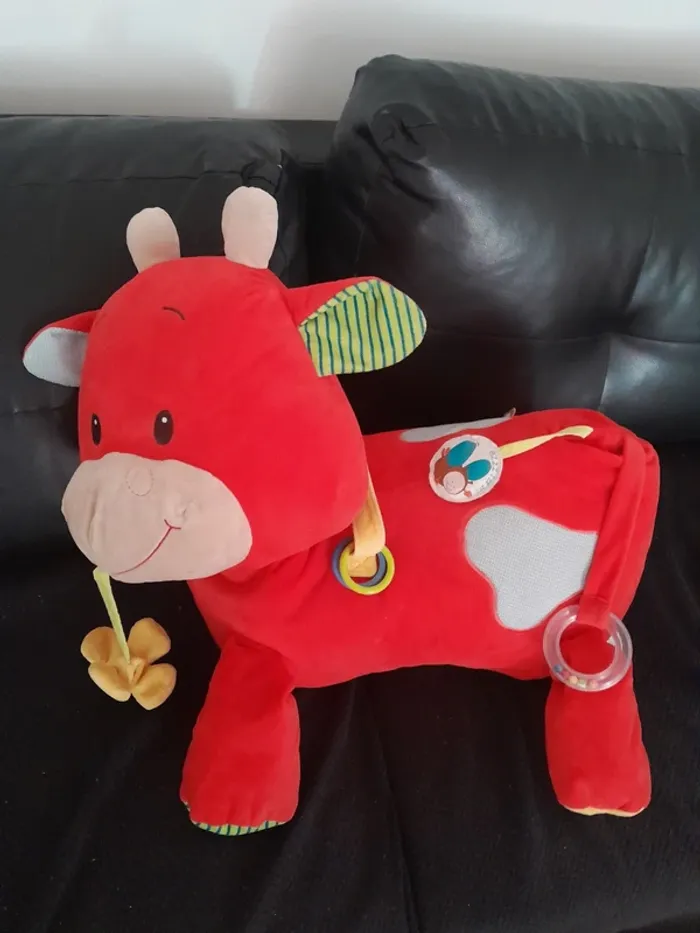 Grosse peluche avec jeux d'éveil