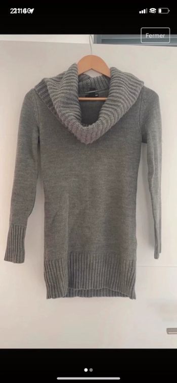 Pull long col roulé.