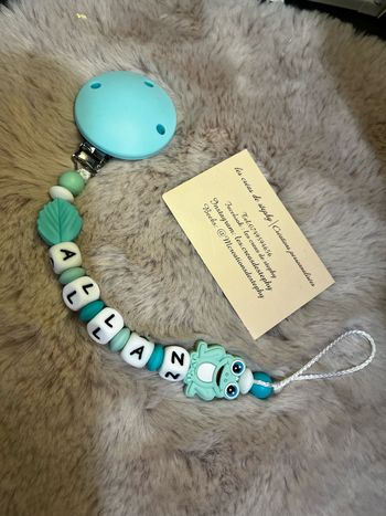 Attache tétine grenouille