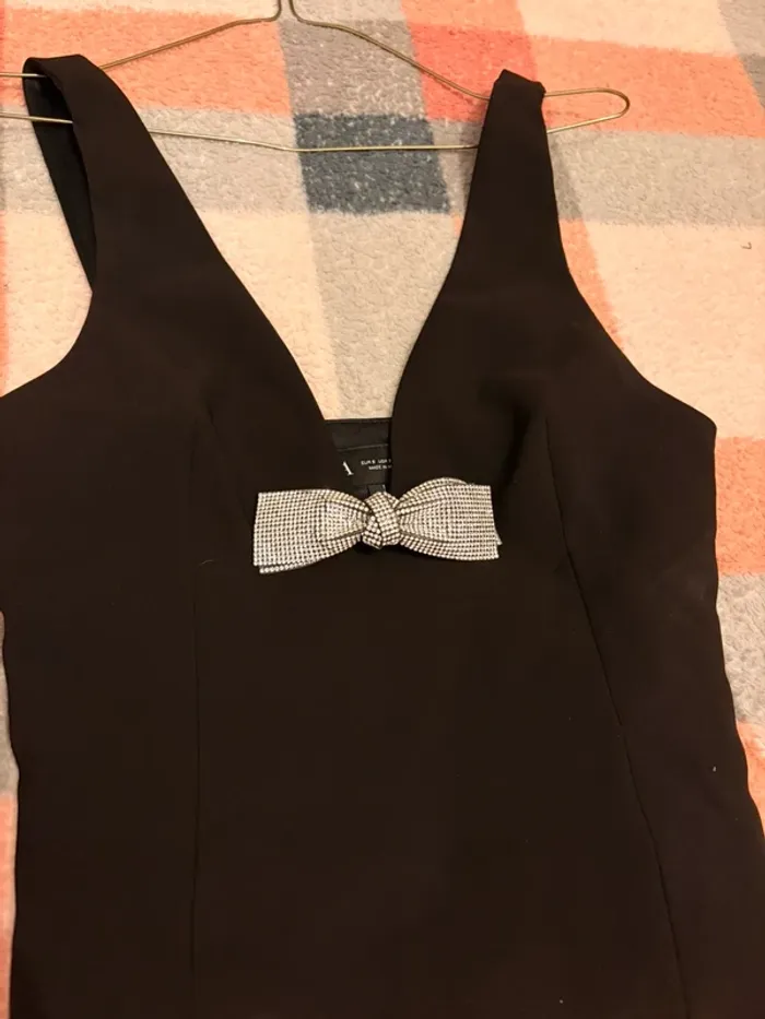 Black top with silver bow
