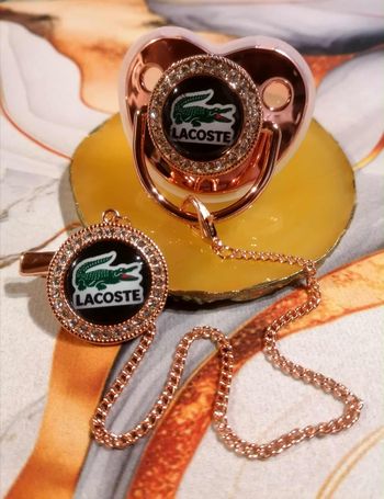 Tétine rose gold Lacoste