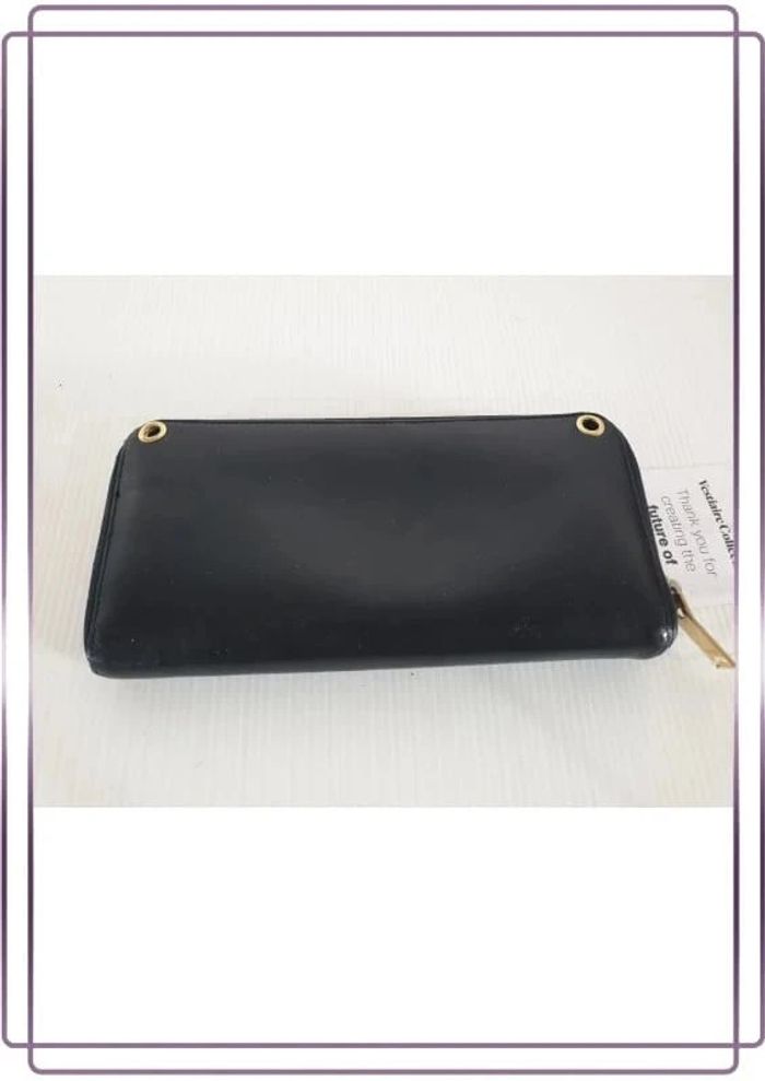 Portefeuille Saint Laurent vintage en cuir, bon état mais quelques  traces d'usures, 20x10cm - photo numéro 2