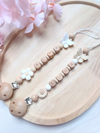 Attache tétine papillon fleur