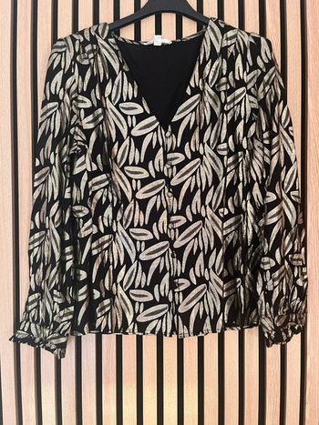 Blouse noire et dorée