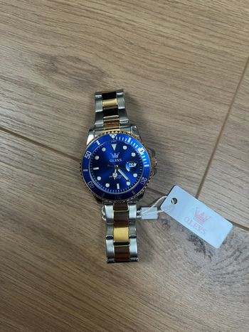 Montre homme OLEVS cadran bleu acier bicolore style plongeuse 