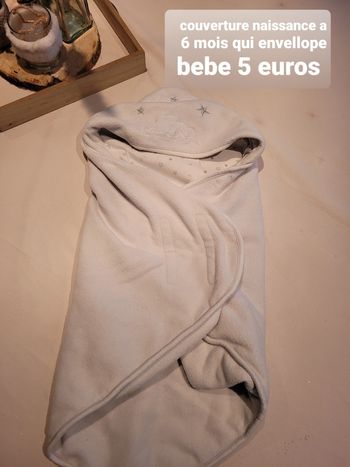 Couverture qui envellope bébé