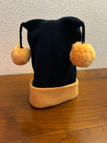 Chapeau avec pompons