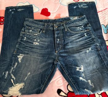 Jeans bleu troué