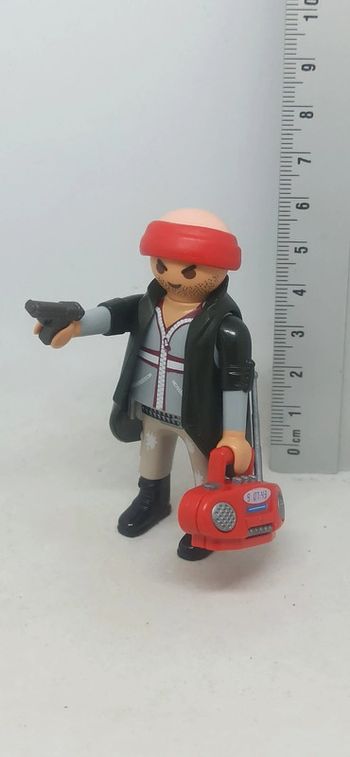 Homme bandit avec radio et arme playmobil