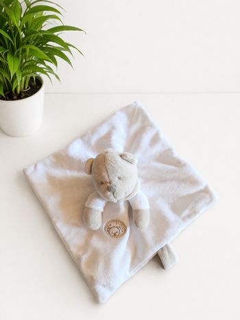 Doudou plat ours blanc gris Nicotoy