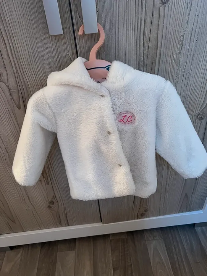 Veste en fourrure blanche 24 mois