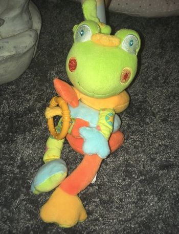 Grenouille en peluche musicale orange vert bleu