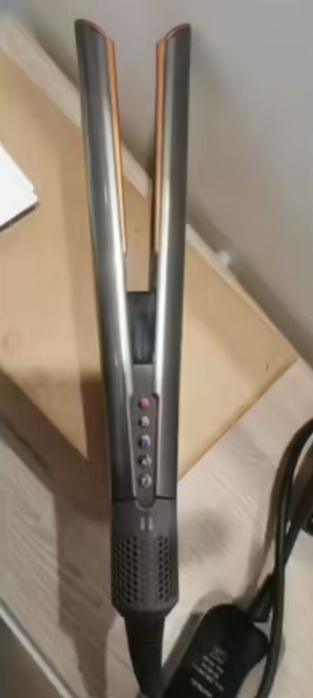 Dyson airstrait sous garantie