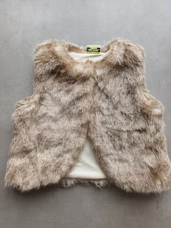 Joli boléro tape à l œil 9 mois