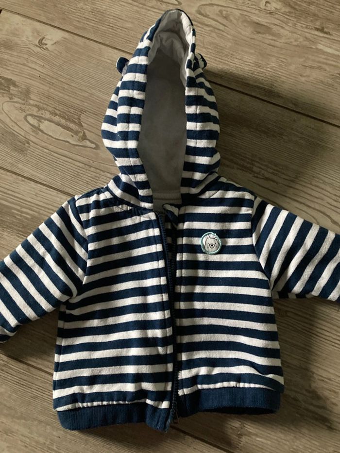 Gilet a capuche
