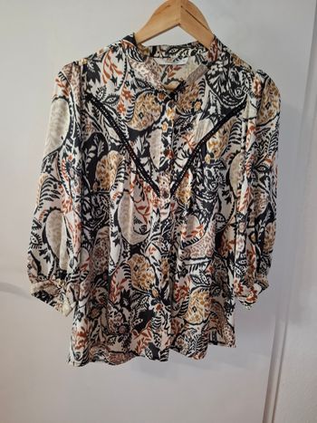 Chemise summum taille 34 peu convenir a une taille 36 en très bon état 