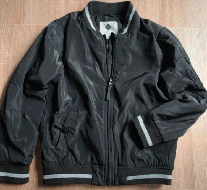 Blouson noir et gris pailleté - 7/8 ans