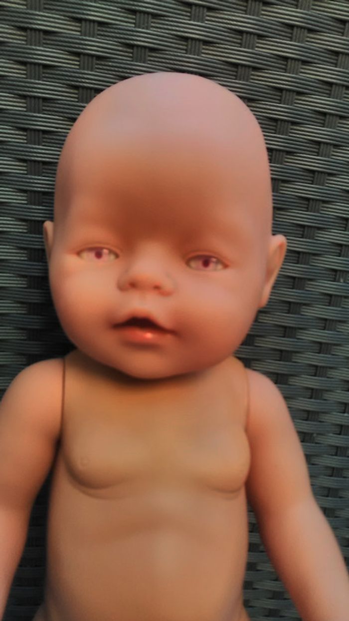 poupon  avec yeux rose  zapf création