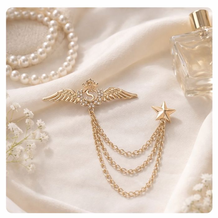 Broche bijou L’Embrochée dorée aile étoile avec chaînes élégante 💎 - photo numéro 2