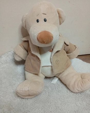 Jolie peluche ours aviateur