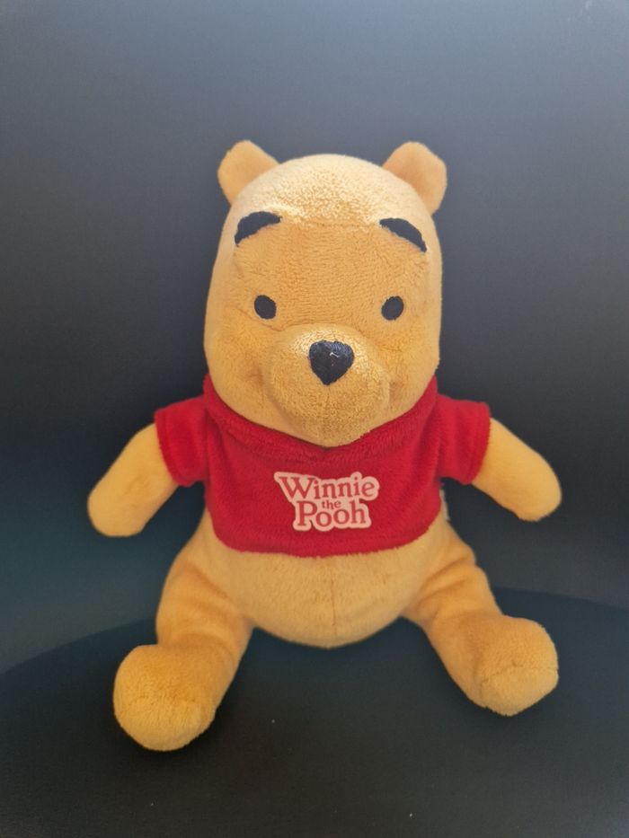Peluche Winnie l'ourson en très bon état