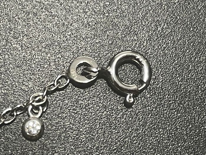 Bracelet en argent et breloques - photo numéro 3