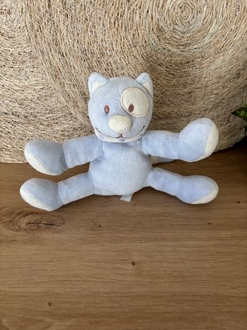 Doudou hochet grelot chat bleu Cocard blanc tex