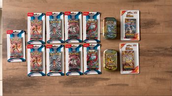 Mini tin evolution prismatique + art set faille paradoxe + booster etincelle deferlante