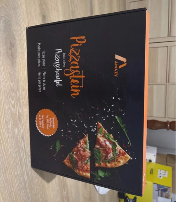 Pierre à pizza neuve sous blister idéal cadeau de Noël