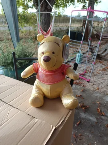 Peluche doudou Winnie l'ourson musical Disney