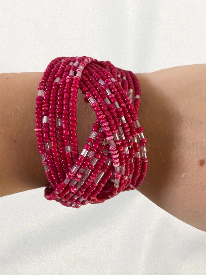 Bracelet rigide perles rose très bon état