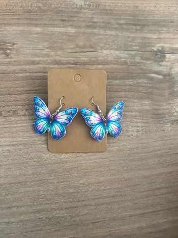 Boucles d’oreilles papillon multicolore neuve