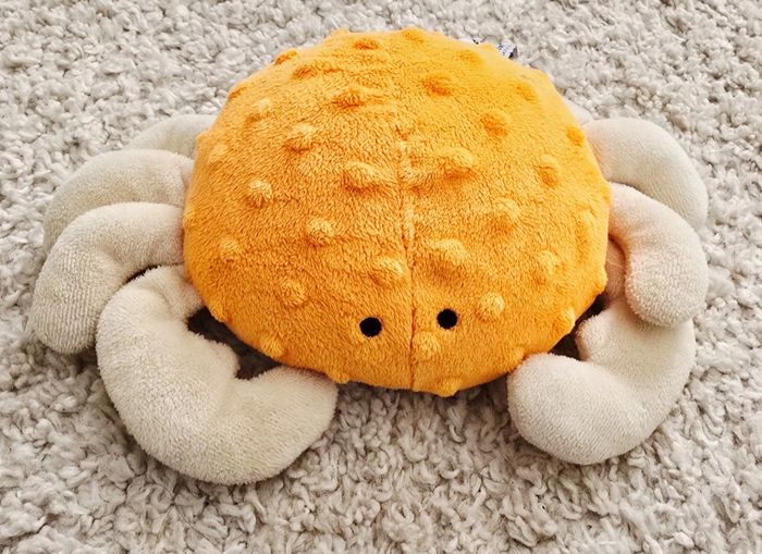 Peluche crabe orange marineland en très bon état