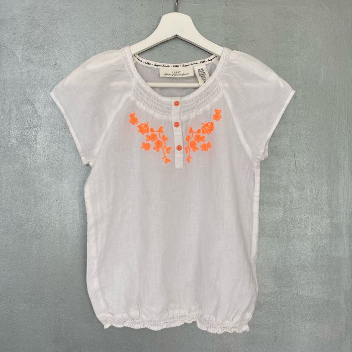 Blouse à manches courtes blanche avec motifs fleuris oranges taille 11 - 12  ans