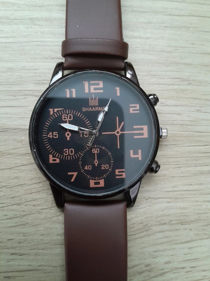 Montre homme noire et argentée, bracelet marron, montre a quartz - photo numéro 6