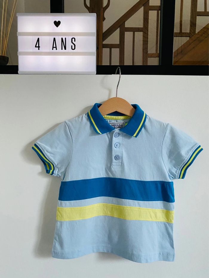 Polo bleu clair avec bandes bleu foncé et jaune - 4 Ans