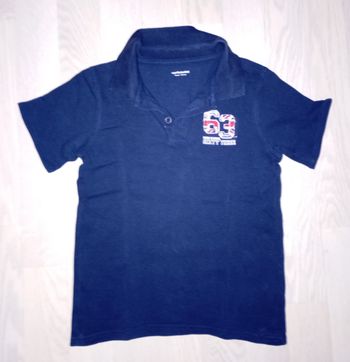 Polo bleu marine motif 63 américain Vert Baudet 
T. 8 ans