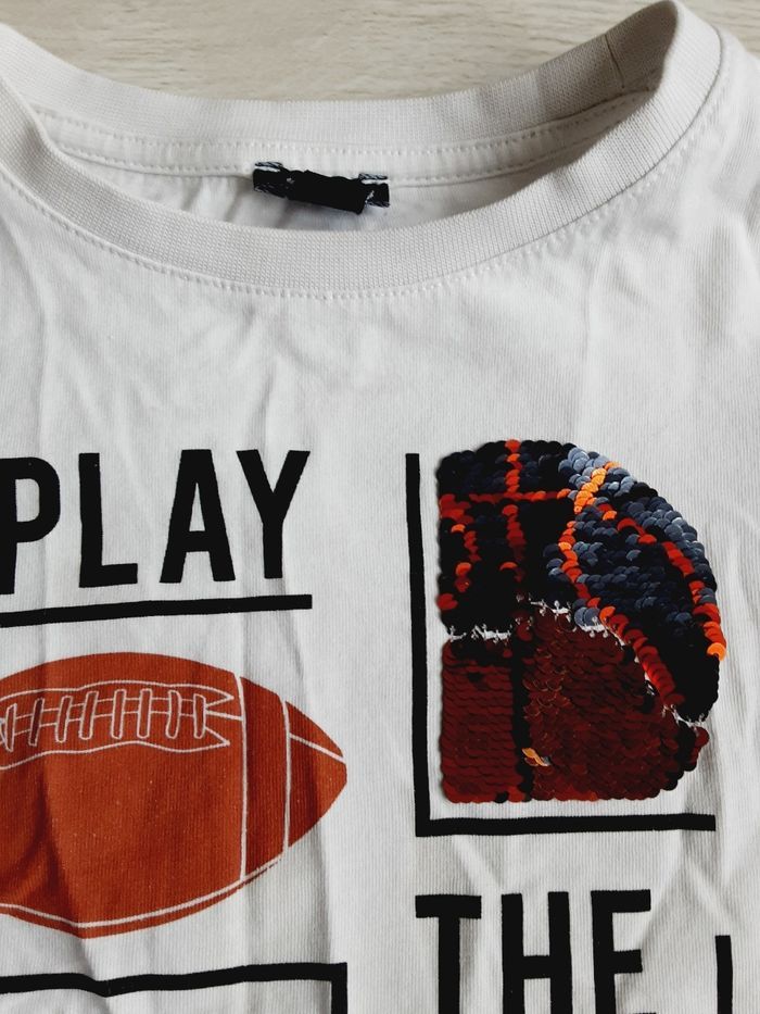 Vêtement garçon tee-shirt à sequins manches courtes blanc sport foot basket Kiabi 4 ans - photo numéro 2