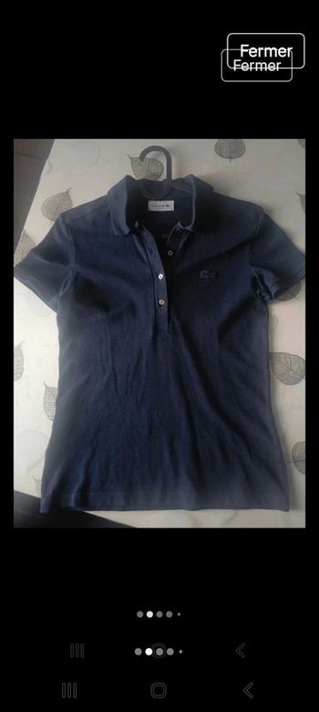 Polo lacoste bleu marine taille xs