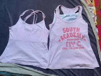 2 hauts taille M rose pimkie
